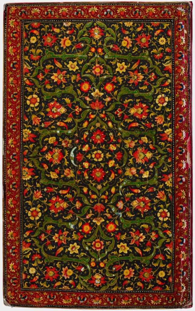 Red white and yellow flowery ornament of a book cover